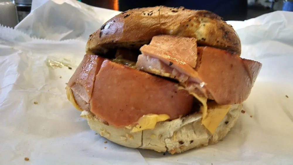 Thick Cut Grilled Bologna and Melted American Cheese on a Onion Bagel